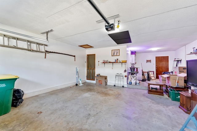 garage with baseboards and a garage door opener