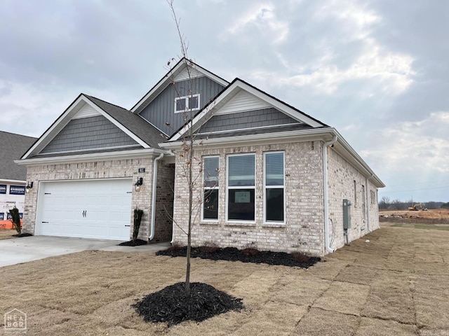 view of front facade with a garage, board and batten siding, concrete driveway, and brick siding