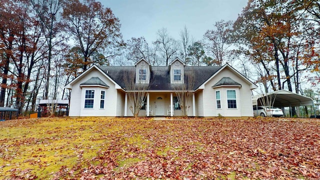 new england style home featuring a detached carport