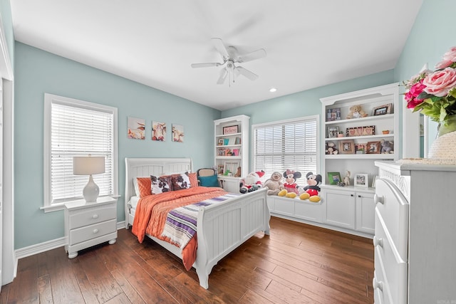 bedroom featuring dark wood-style floors, ceiling fan, and baseboards