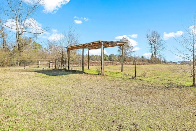 view of yard featuring a carport and a rural view