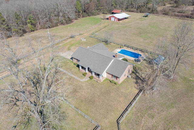 birds eye view of property with a rural view