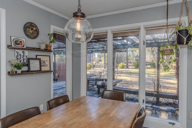 dining area featuring crown molding
