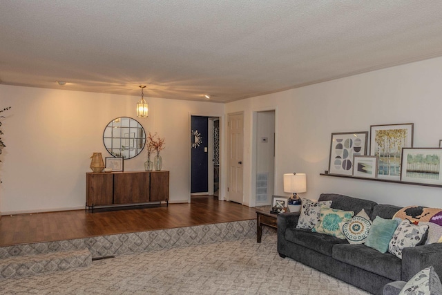 living room with wood finished floors and a textured ceiling