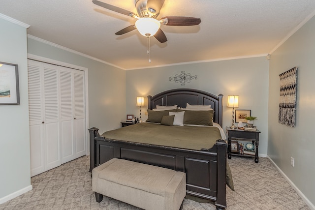 bedroom with light carpet, baseboards, crown molding, and a closet