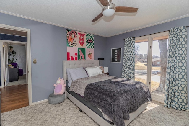 bedroom with baseboards, ceiling fan, a textured ceiling, crown molding, and access to exterior