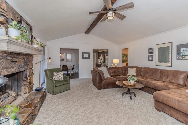 carpeted living room with lofted ceiling with beams, a fireplace, and a ceiling fan