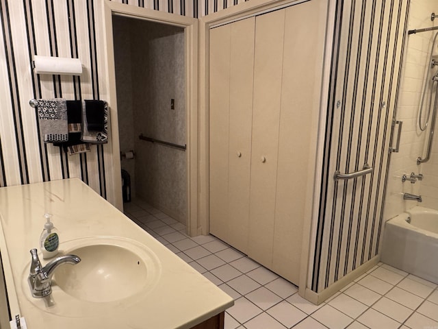 bathroom with tub / shower combination, tile patterned flooring, and vanity