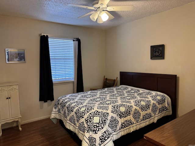 bedroom featuring dark wood-style floors, ceiling fan, a textured ceiling, and baseboards