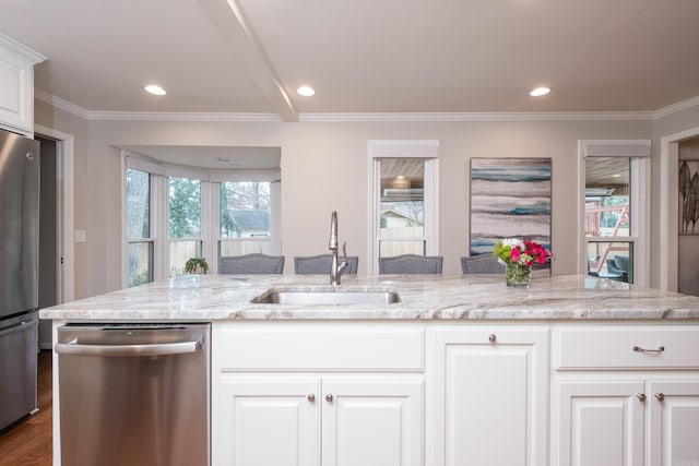 kitchen featuring crown molding, stainless steel appliances, a sink, and light stone countertops