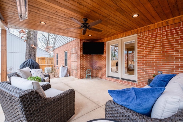 view of patio / terrace with fence and a ceiling fan