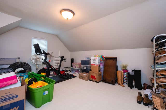 interior space with lofted ceiling and carpet flooring