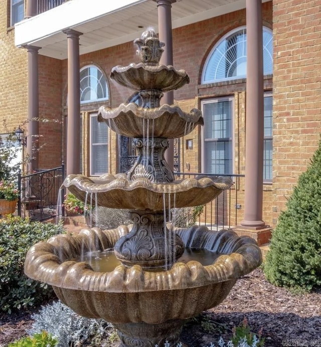 exterior details with brick siding and ornate columns