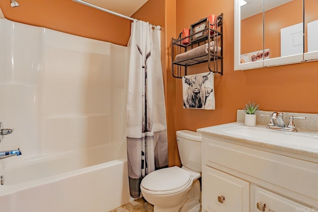 full bath with shower / tub combo, vanity, and toilet