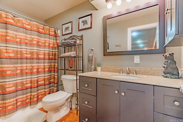 full bath featuring toilet and vanity