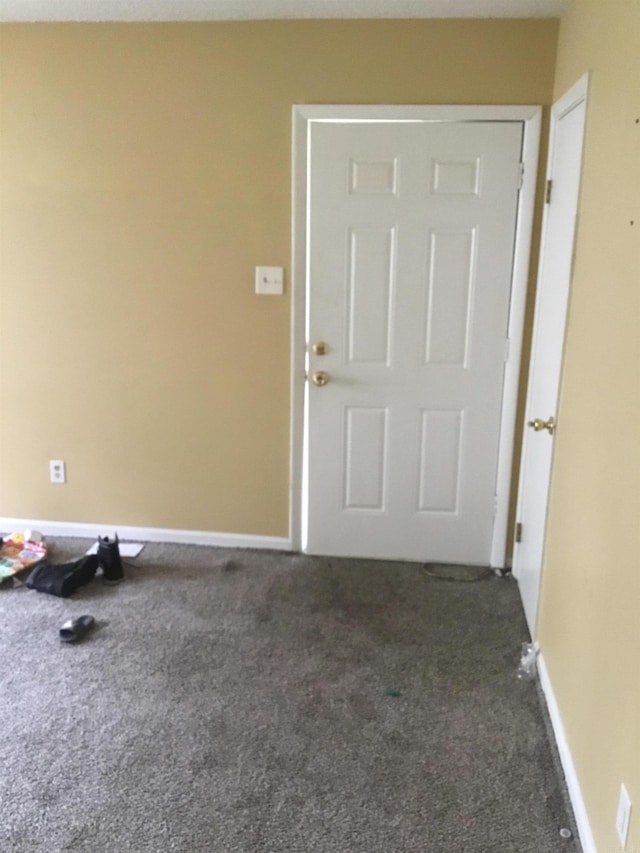 interior space featuring baseboards
