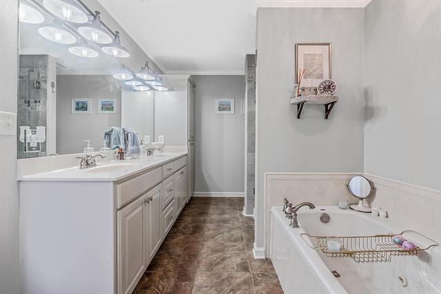 full bath featuring a garden tub, double vanity, ornamental molding, and a sink