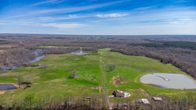 aerial view featuring a forest view and a water view