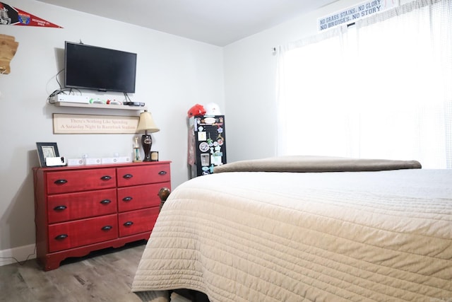 bedroom with light wood-type flooring