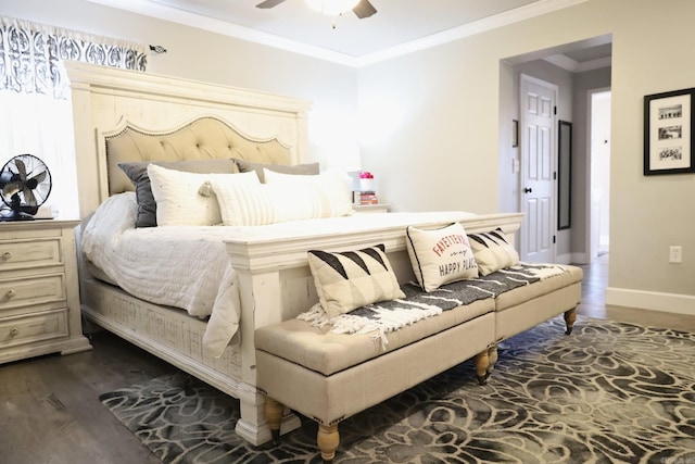 bedroom featuring baseboards, dark wood finished floors, a ceiling fan, and crown molding