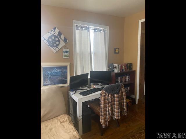 office with dark wood-style flooring