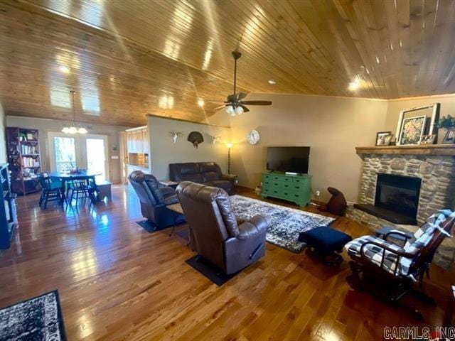 living area with wooden ceiling and wood finished floors