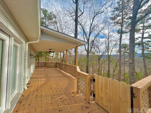 wooden terrace featuring ceiling fan