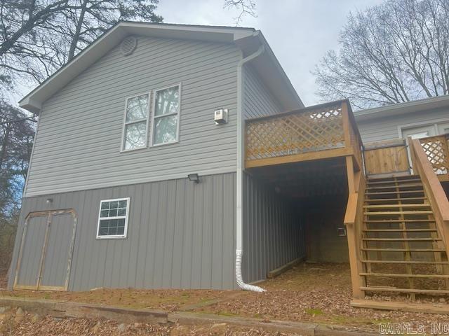 view of side of home with stairs