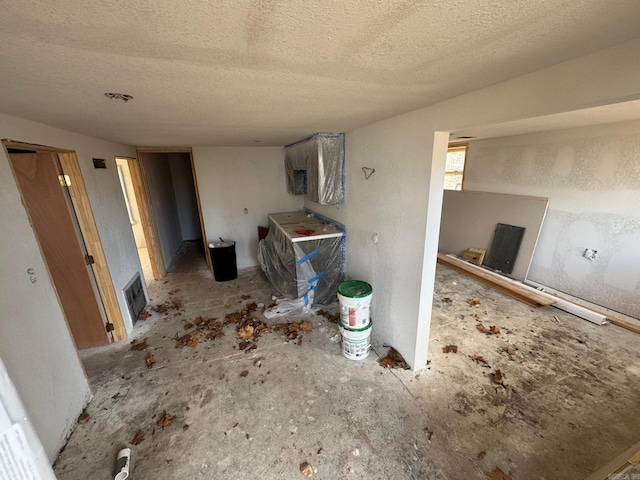 interior space featuring a textured ceiling