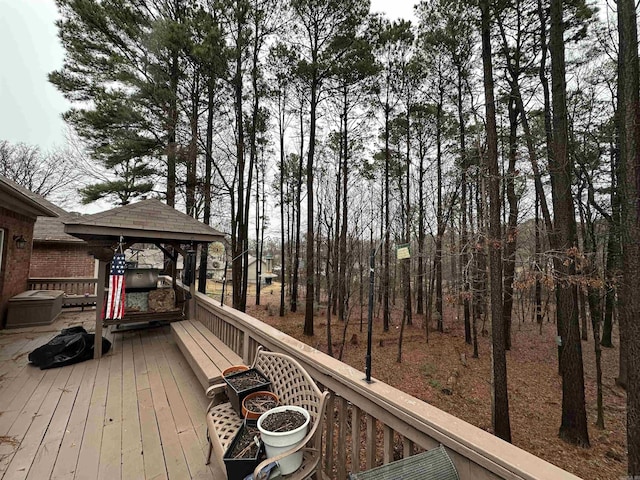 wooden terrace featuring a gazebo