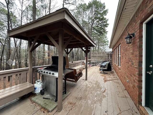 wooden terrace with fence and a gazebo