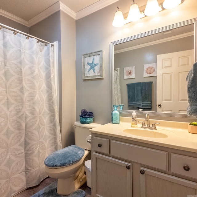 full bath featuring crown molding, vanity, and toilet