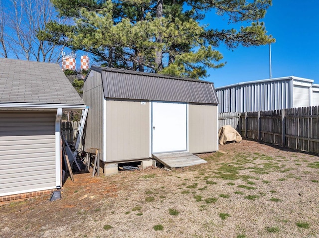 view of shed featuring a fenced backyard