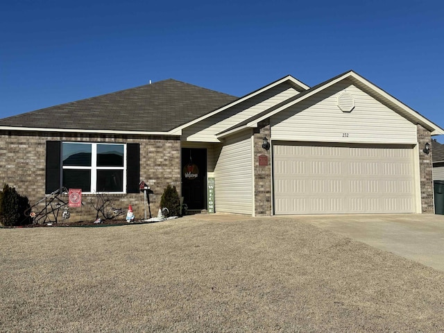 ranch-style home featuring an attached garage, a shingled roof, concrete driveway, and brick siding