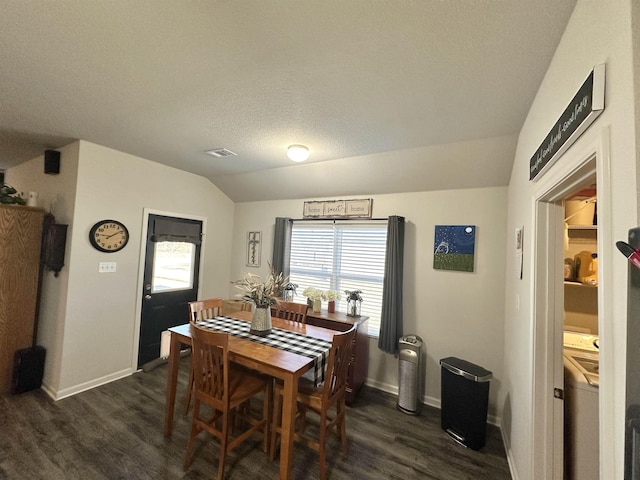 dining room featuring vaulted ceiling, a textured ceiling, dark wood-style floors, and baseboards