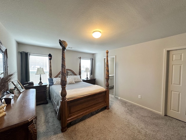 bedroom featuring a textured ceiling, dark carpet, visible vents, and baseboards