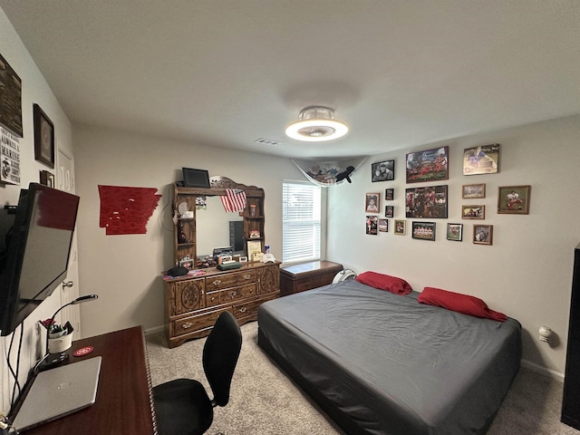 bedroom featuring carpet floors, baseboards, and visible vents