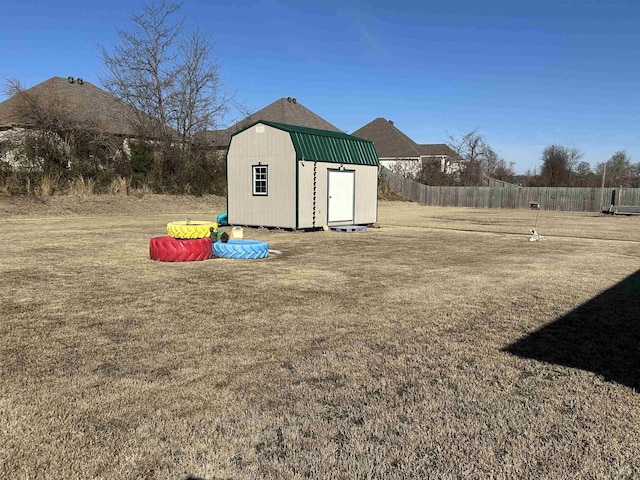 view of shed with fence