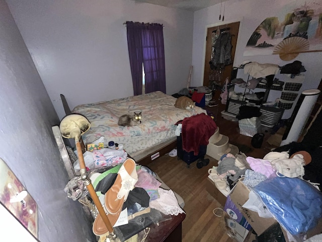 bedroom with wood finished floors