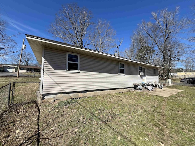 back of property with a patio, a lawn, and fence