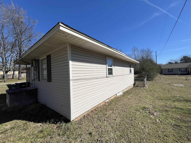 view of home's exterior featuring a lawn