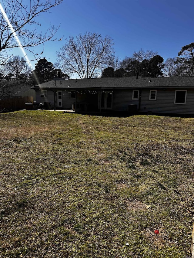 back of house with a yard