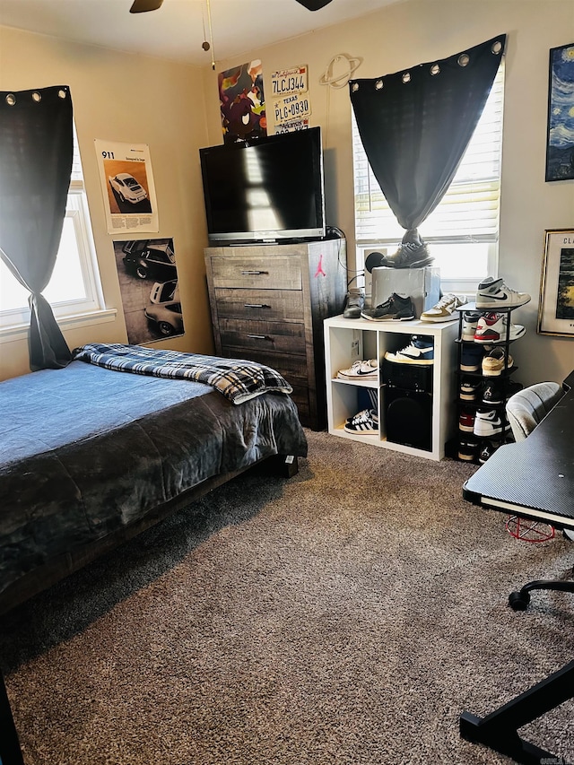 carpeted bedroom featuring ceiling fan