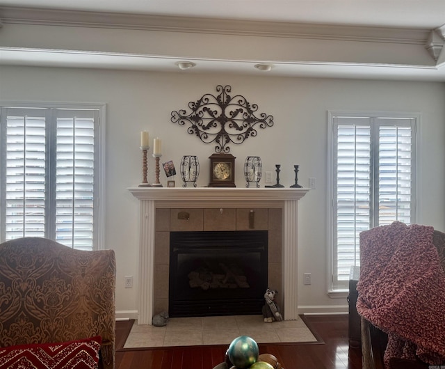 interior space with a tiled fireplace and light wood-style flooring