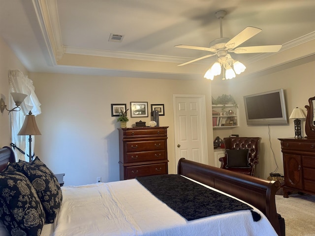 carpeted bedroom with visible vents, ornamental molding, and a ceiling fan