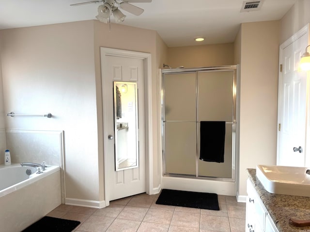 full bath featuring a stall shower, vanity, visible vents, and tile patterned floors