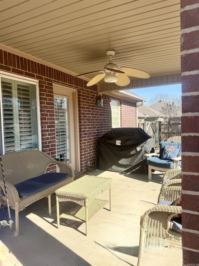 view of patio with a grill and a ceiling fan