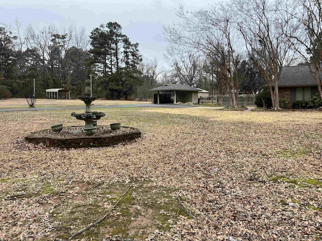 view of yard with an attached carport