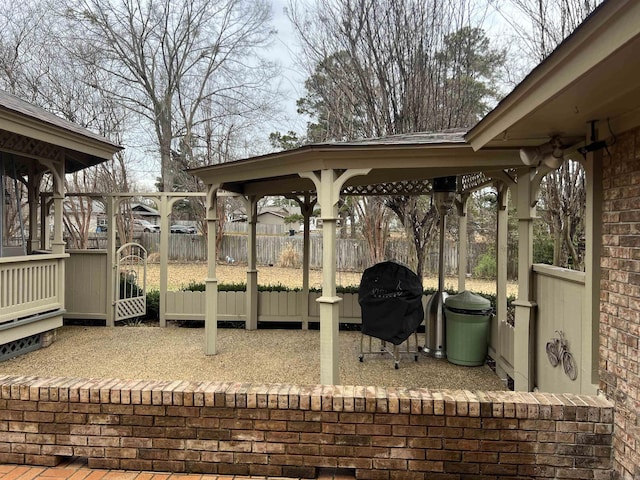 view of patio / terrace featuring fence and grilling area