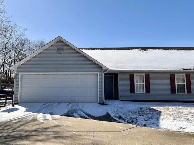 single story home featuring a garage